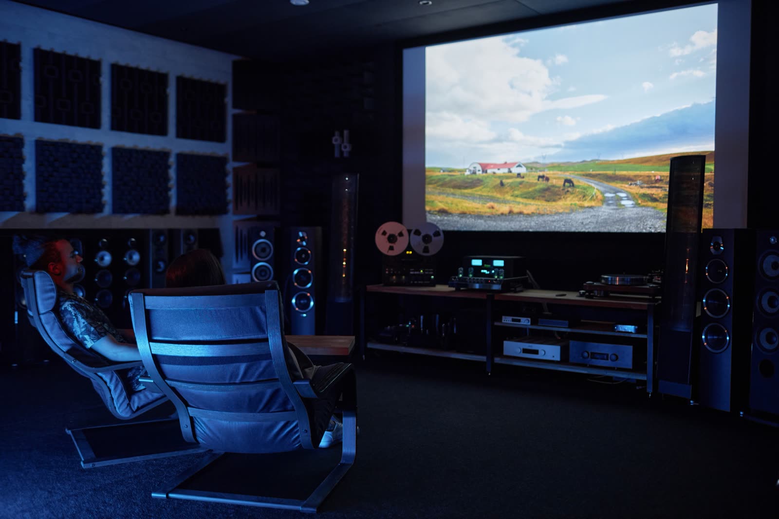 Home theatre with projector, speakers, and seating